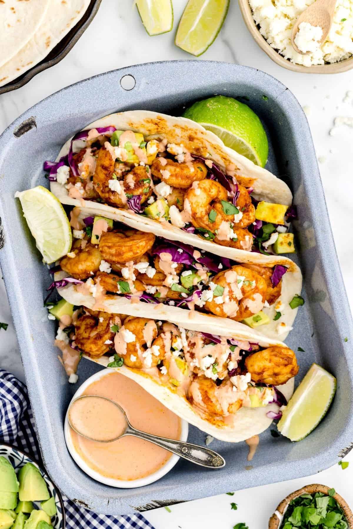 Delicious crispy shrimp tacos with fresh toppings in an air fryer, perfect for quick seafood meals.